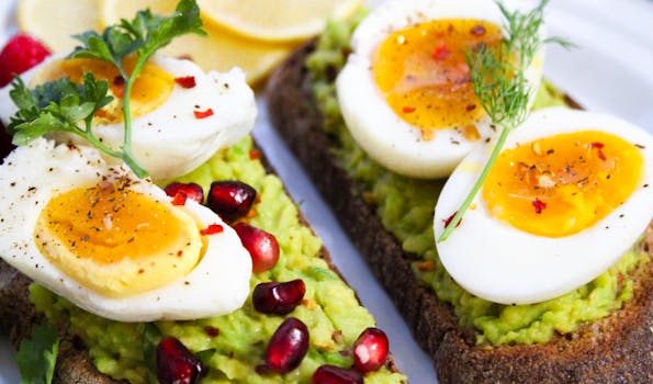 A delicious breakfast sandwich layered with eggs, avocado, and sauerkraut